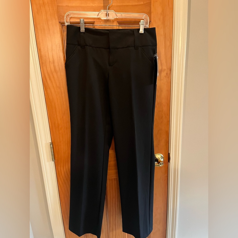Ladies, new tags, black dress pants by Daisy Fuentes size 4